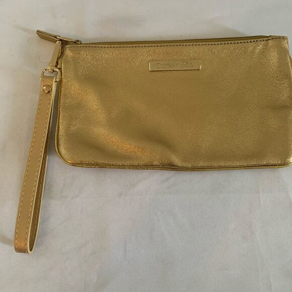 Tiffany & Co. Handbags - Tiffany & Co Gold Leather Pouch/Clutch